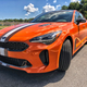 Illustration for article titled Someone Thought This Cleveland Browns-Themed Kia Stinger GTS Was A Good Idea